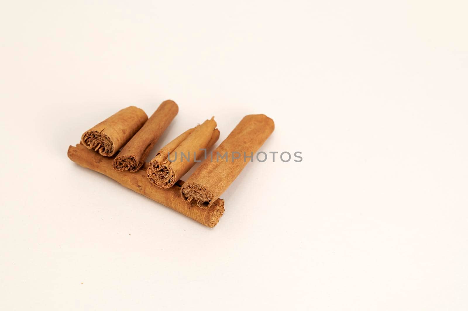 Closeup view of Cinnamon sticks on a white background
