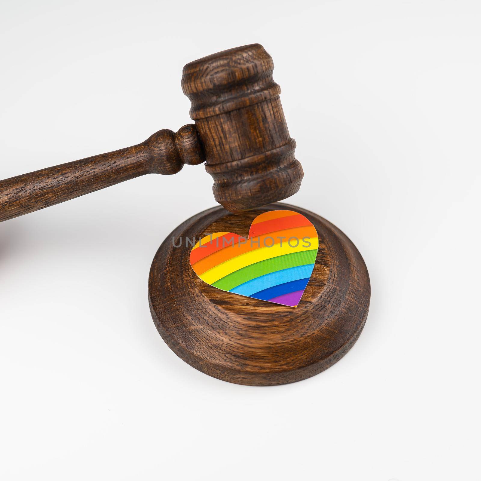 The judge hits a heart with a rainbow flag with a gavel