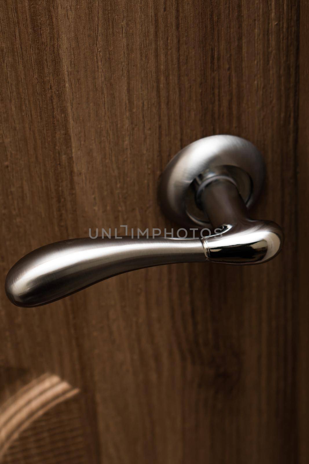 handle in the door, metal handle, in the wooden door