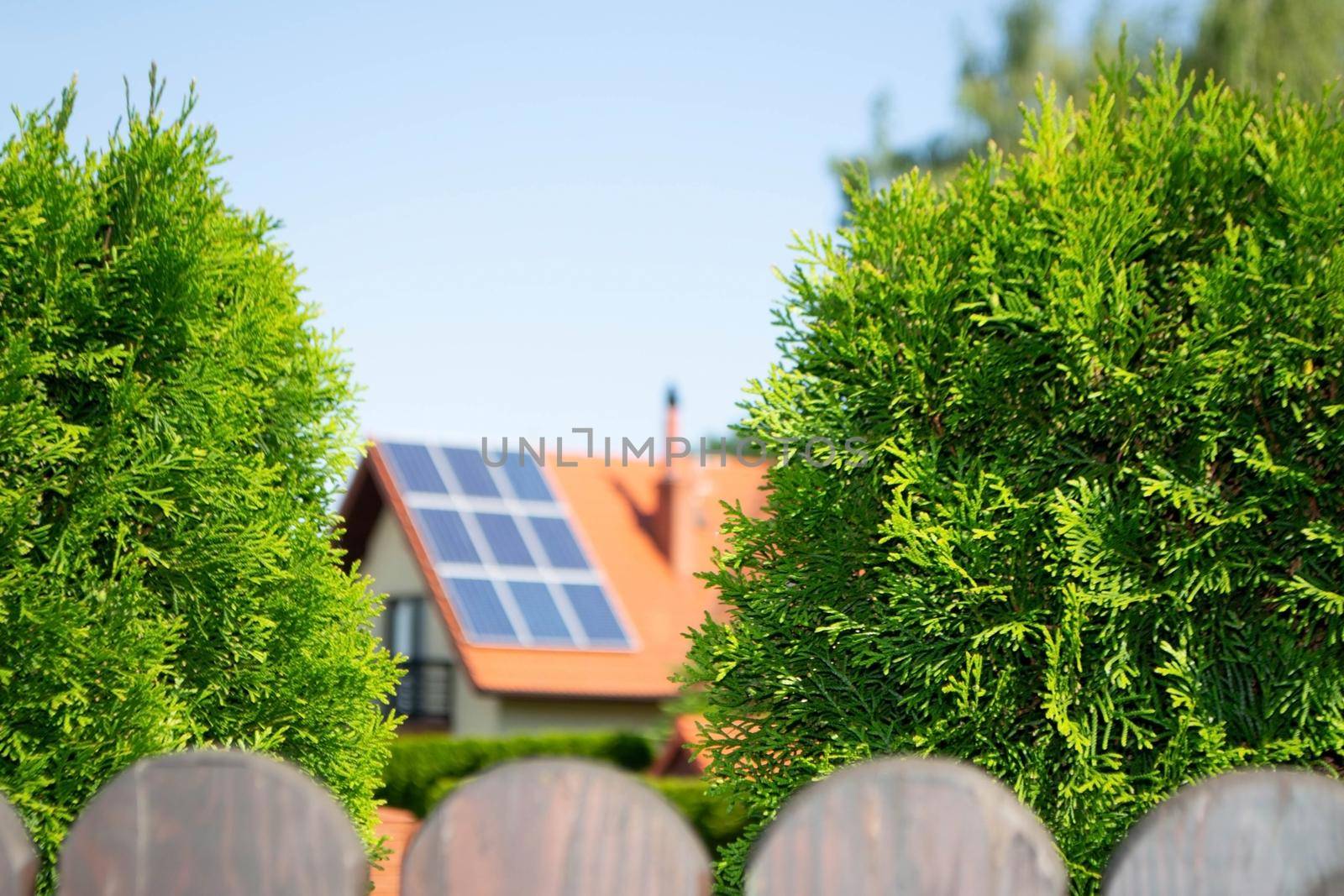 House roof with photovoltaic modules. Historic farm house with modern solar panels on roof and wall High quality photo