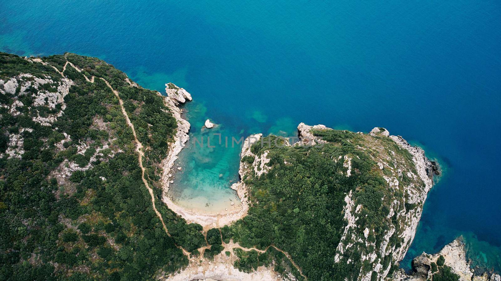Aerial view of Porto Timoni beach and pirate bay on Corfu island in Greece by driver-s