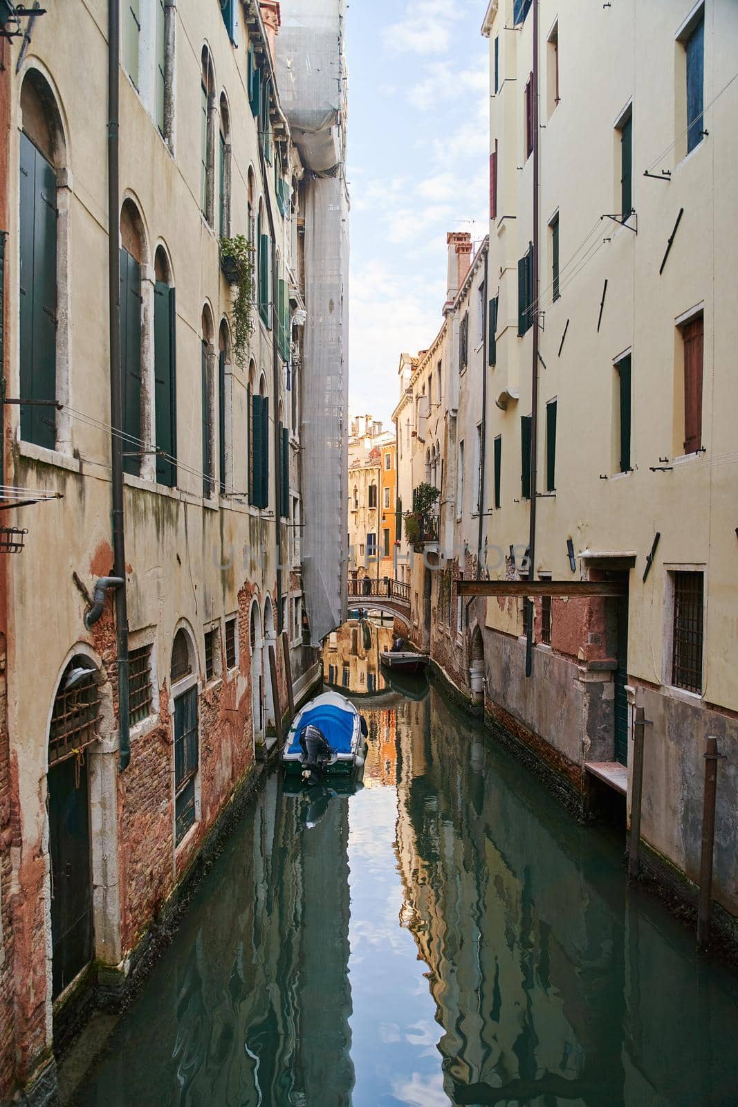 Venice, Italy - 10.12.2021: Traditional canal street with gondolas and boats in Venice, Italy. by driver-s