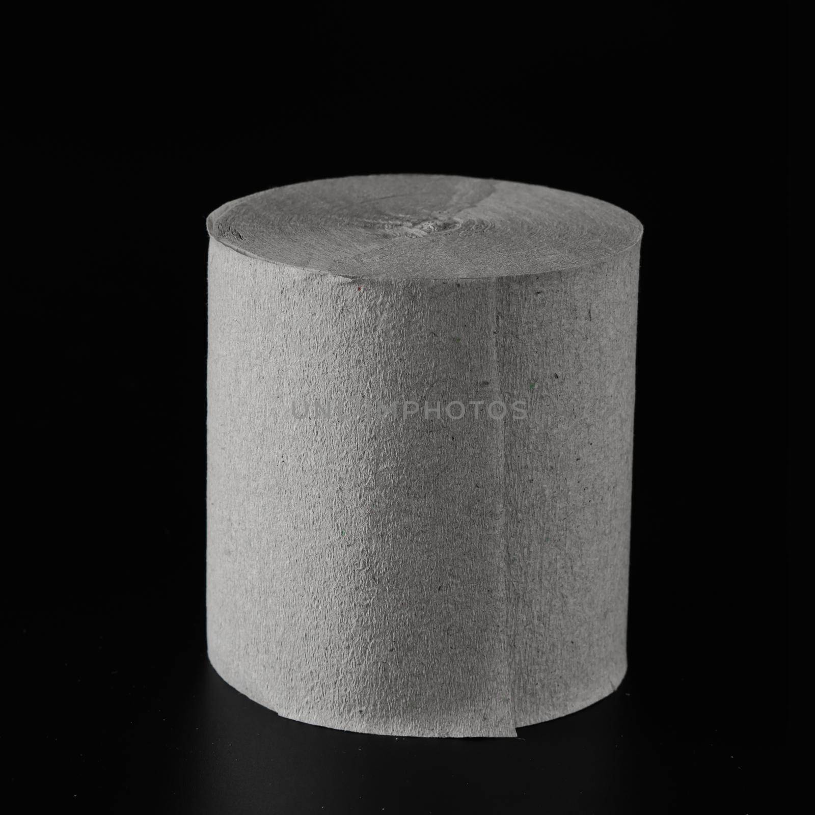 Roll of toilet paper, on black background isolated