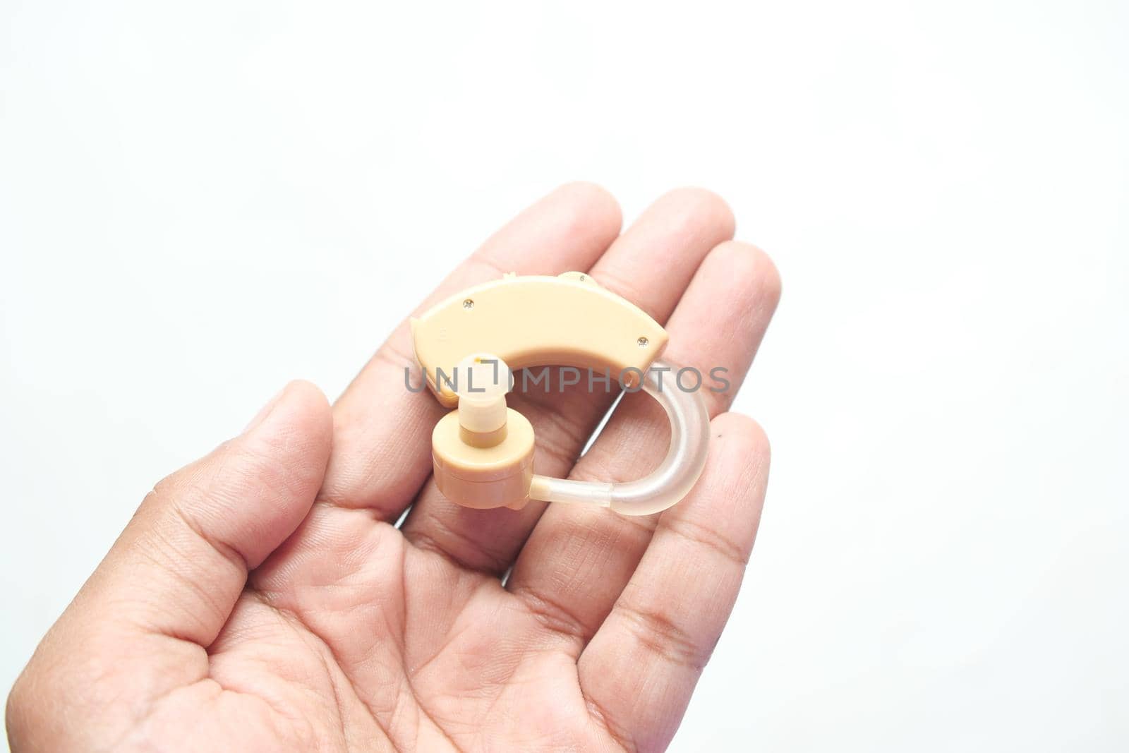 Hearing aid equipment on hand top view ,