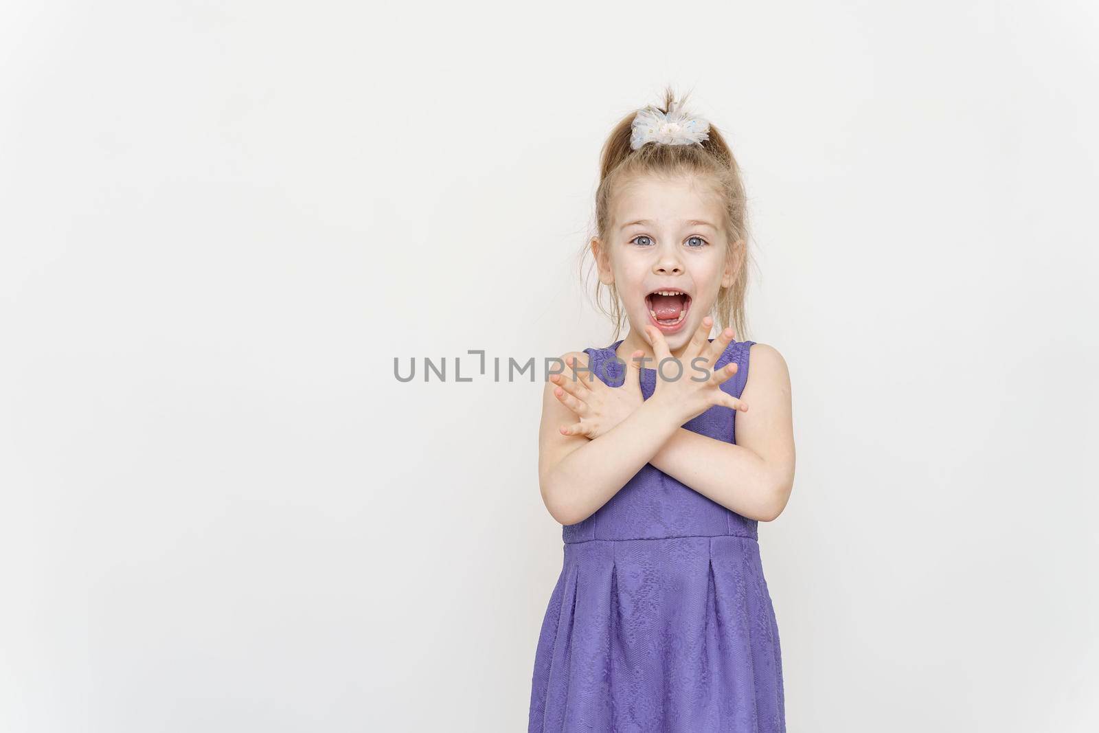 portrait of a little girl in a blue dress with a shocked expression by Lena_Ogurtsova
