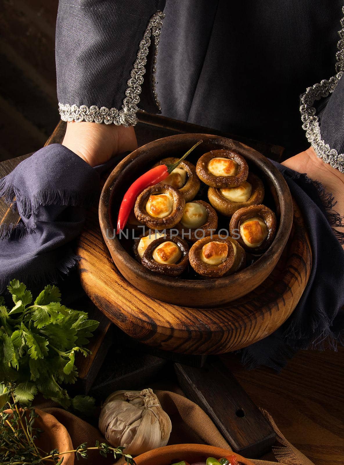 Shot of a person putting dishes on the table by A_Karim