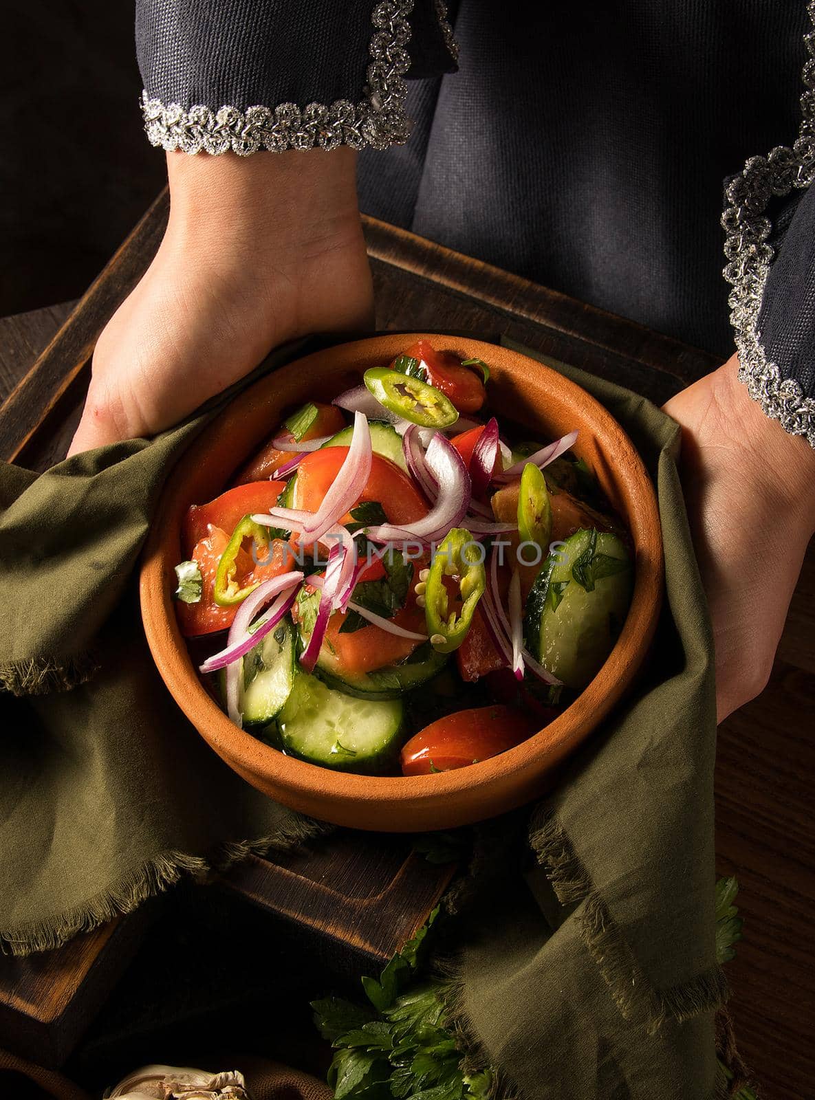 A shot of a person putting dishes on the table