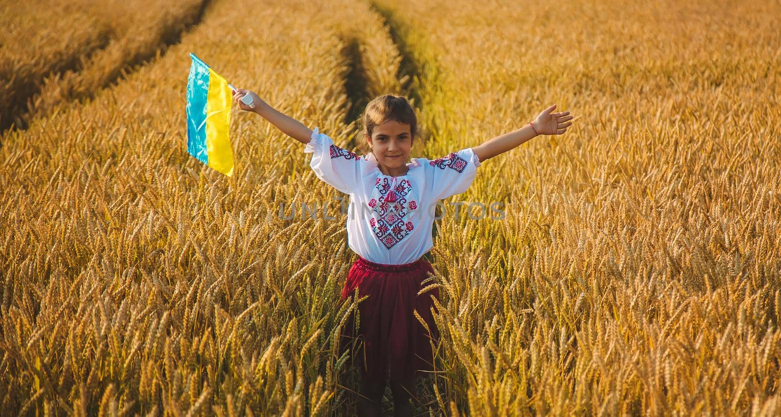 Child in a wheat field. In vyshyvanka, the concept of the Independence Day of Ukraine. Selective focus. Kid.