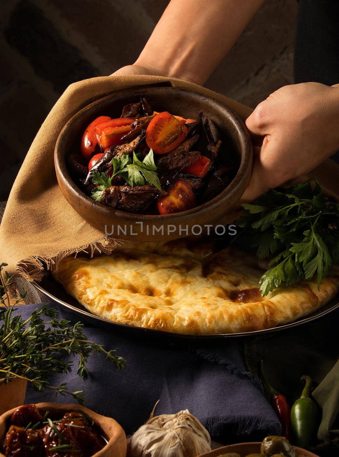 Vertical shot of a chef serving a gourmet salad dish by A_Karim