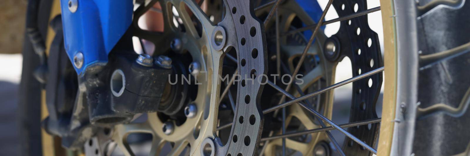 Close-up of metal parts of bike-chain, switch and rear cassette, brakes or gear levers. A sprocket on bicycle wheel, bike gearbox and black electric motor