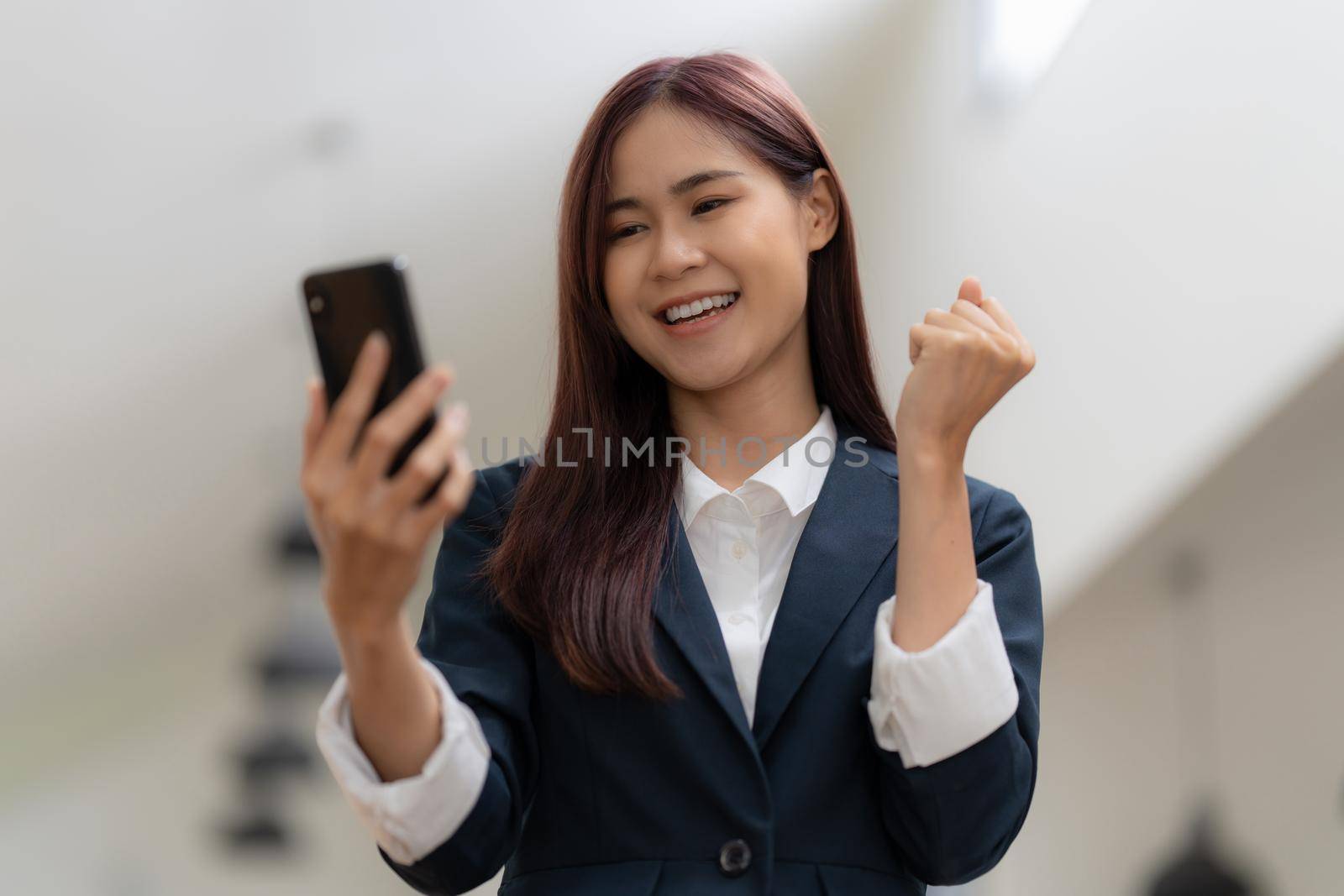 A businesswoman completes KYC using an online banking program in order to open a digital savings account. The definition of cyber security