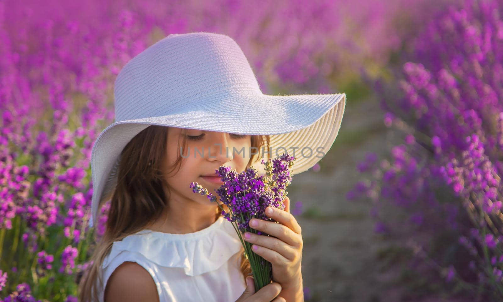 A child in a lavender field. Selective focus. Nature.