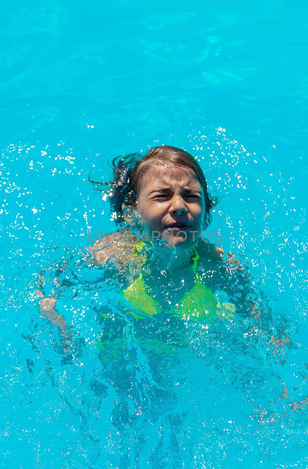 The child is drowning in water. Selective focus. by yanadjana