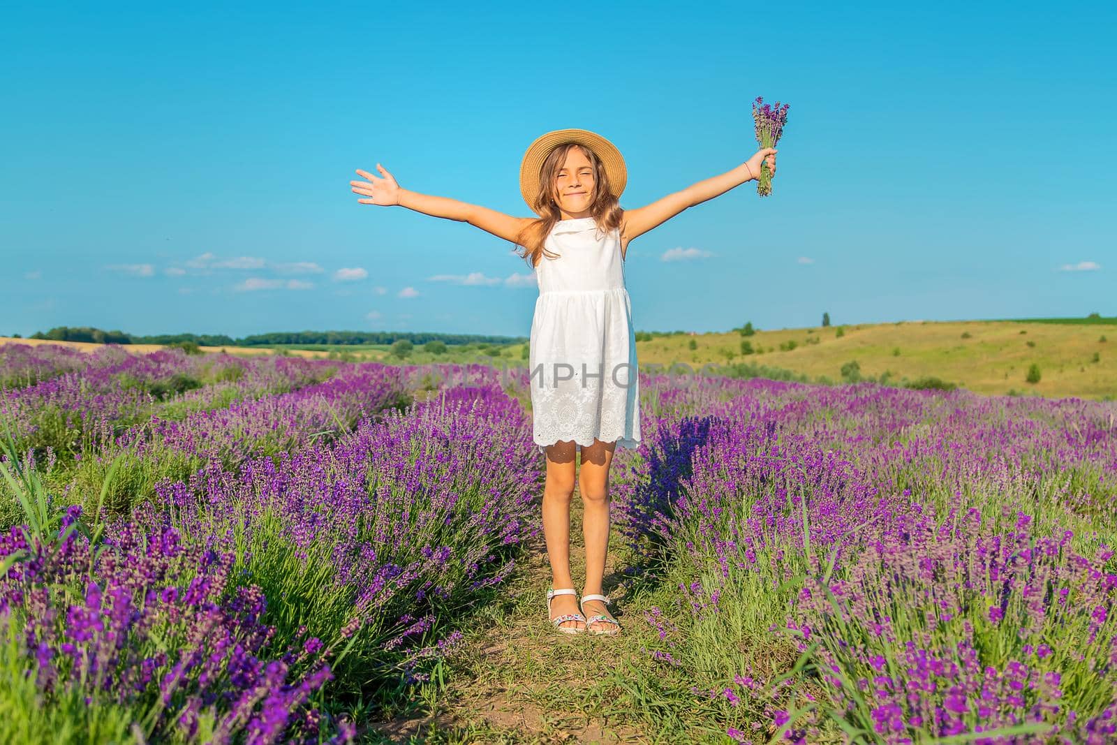 A child in a lavender field. Selective focus. Nature.