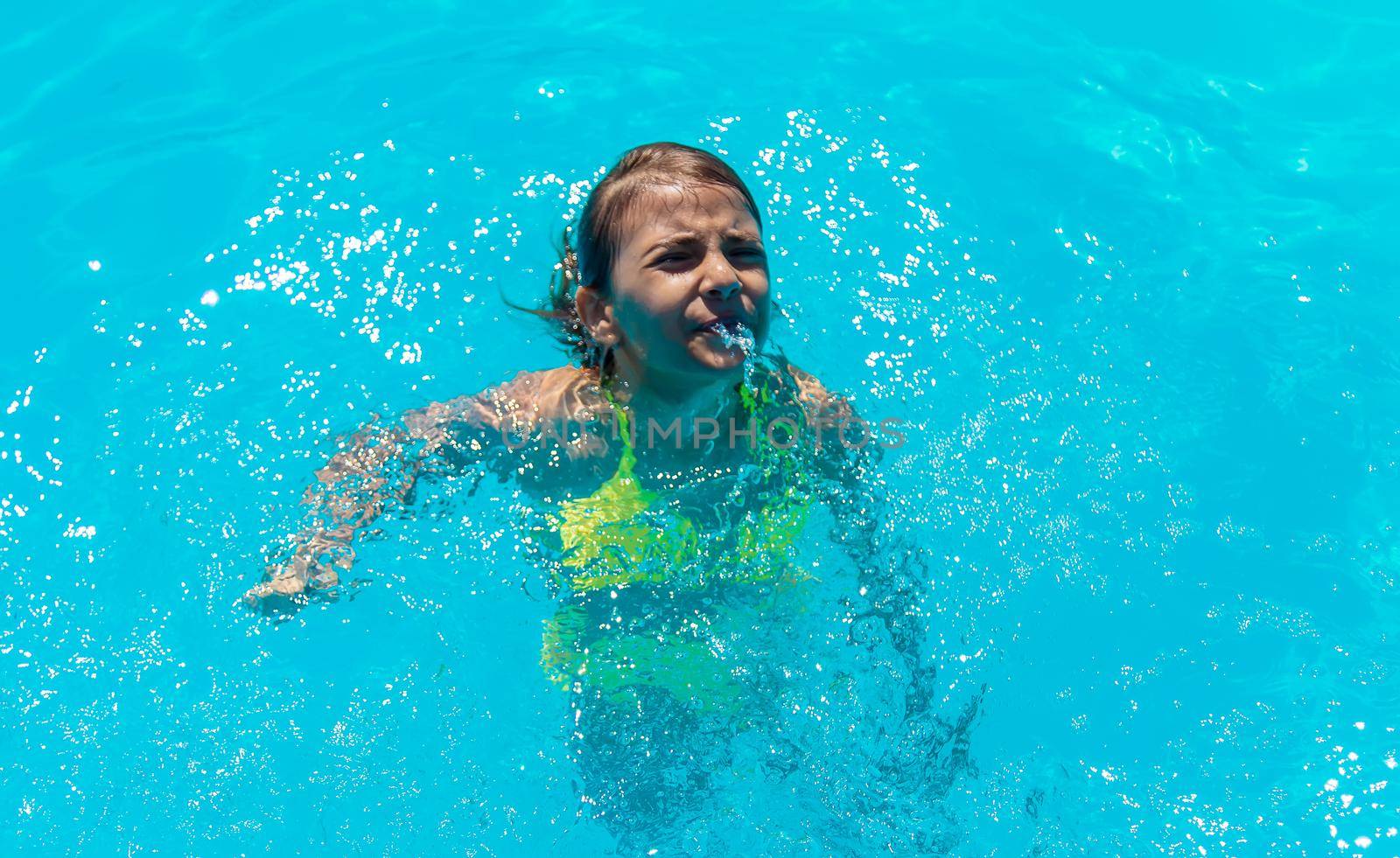 The child is drowning in water. Selective focus. Kid.