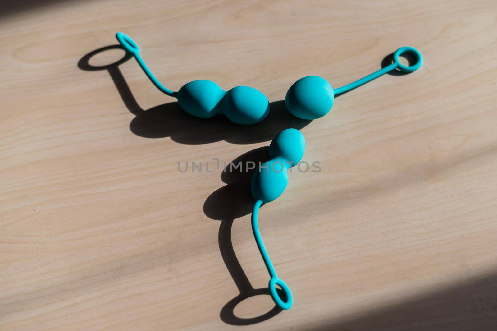 Set of blue vaginal latex balls. Fitness equipment for women's health. Sexual toys for intimate muscles. Kegel simulator for the muscles of the pelvic floor