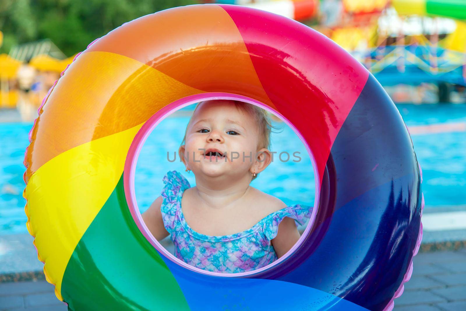 Baby with a circle near the pool. Selective focus. Child.