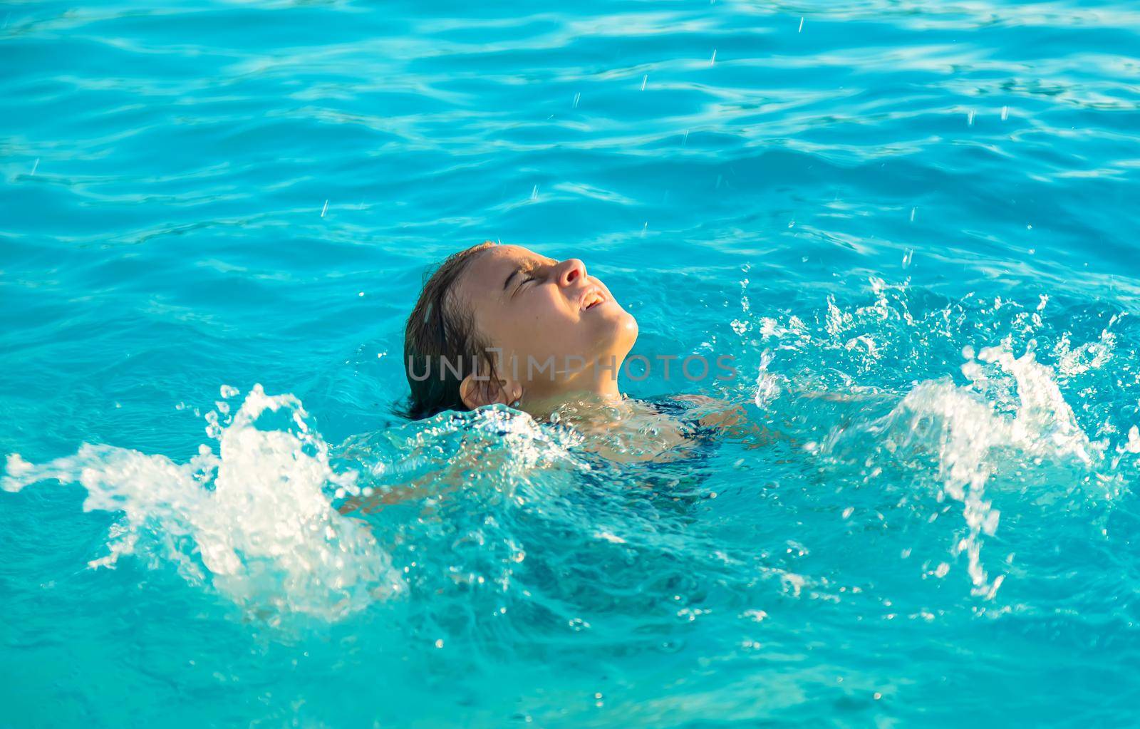 The child is drowning in water. Selective focus. Kid.