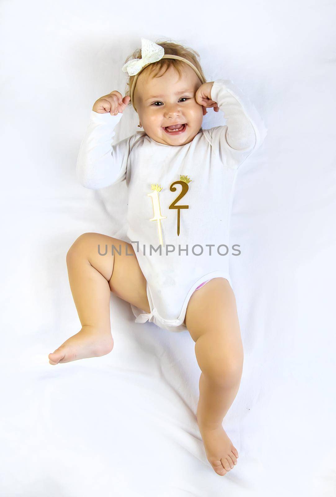 The child is a girl of 12 months. Selective focus. Child.