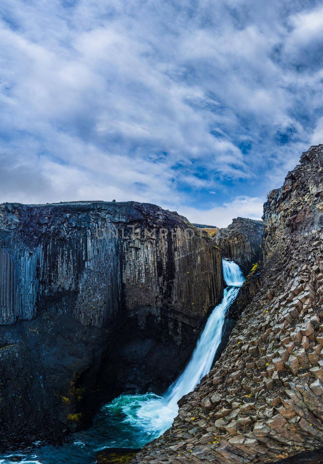 Litlanefoss waterfall with basalt columns closeup panorama