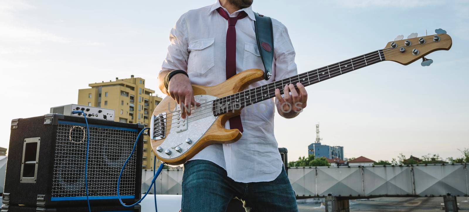 Bass player playing outdoors in a festival by SimmiSimons