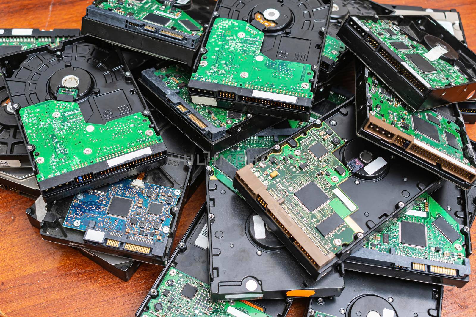Obsolete hard drives piled up for recycling by Skaron