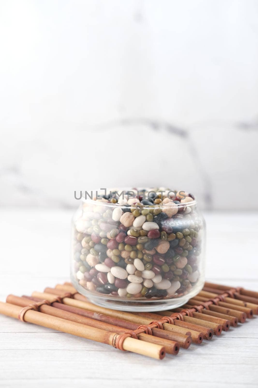 mixed beans in a bowl on table .