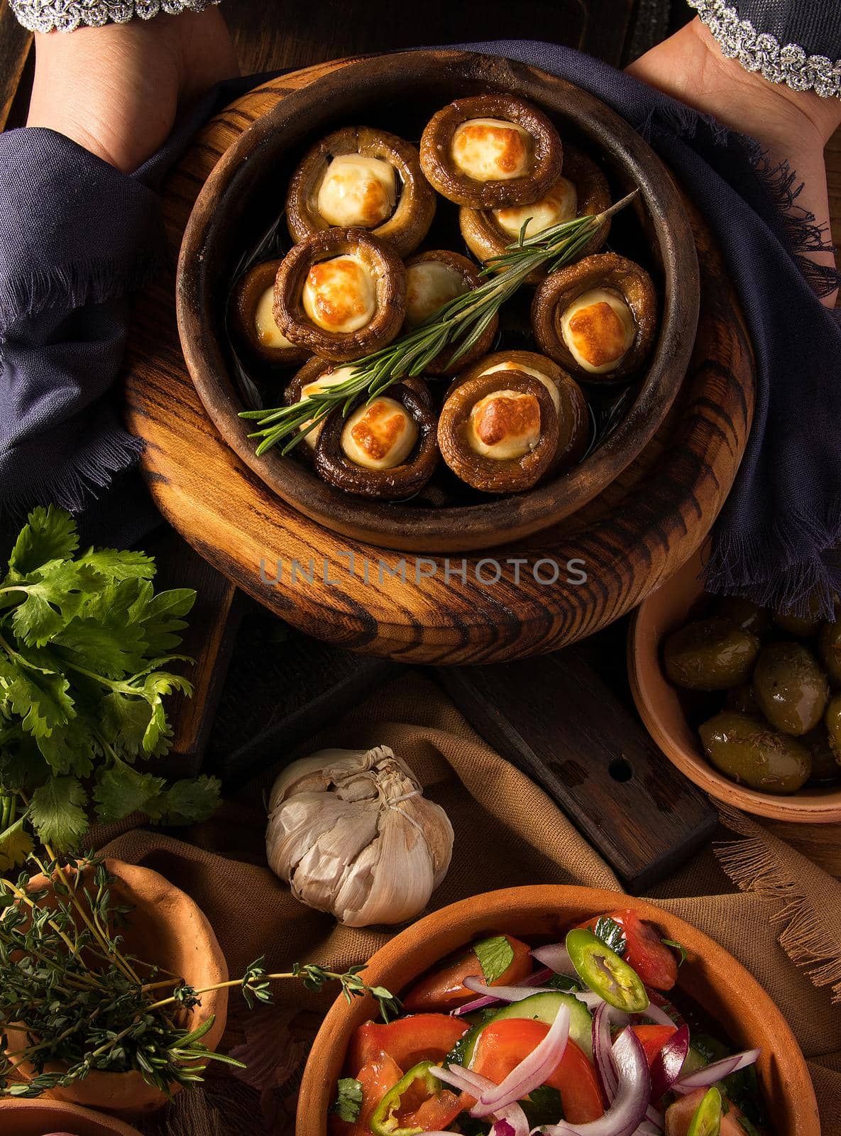 Shot of a person putting dishes on the table by A_Karim