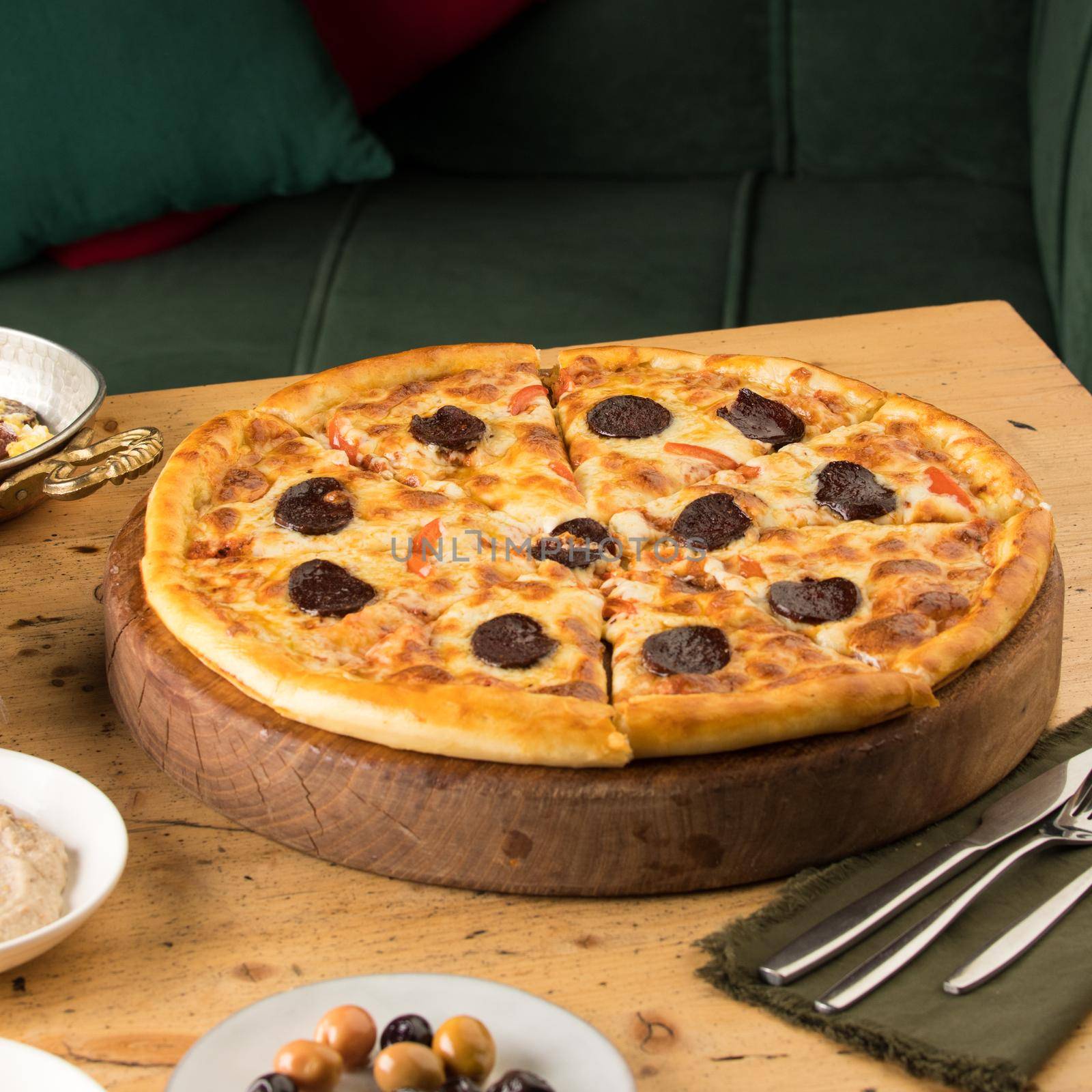 A closeup of freshly-baked pizza on a table