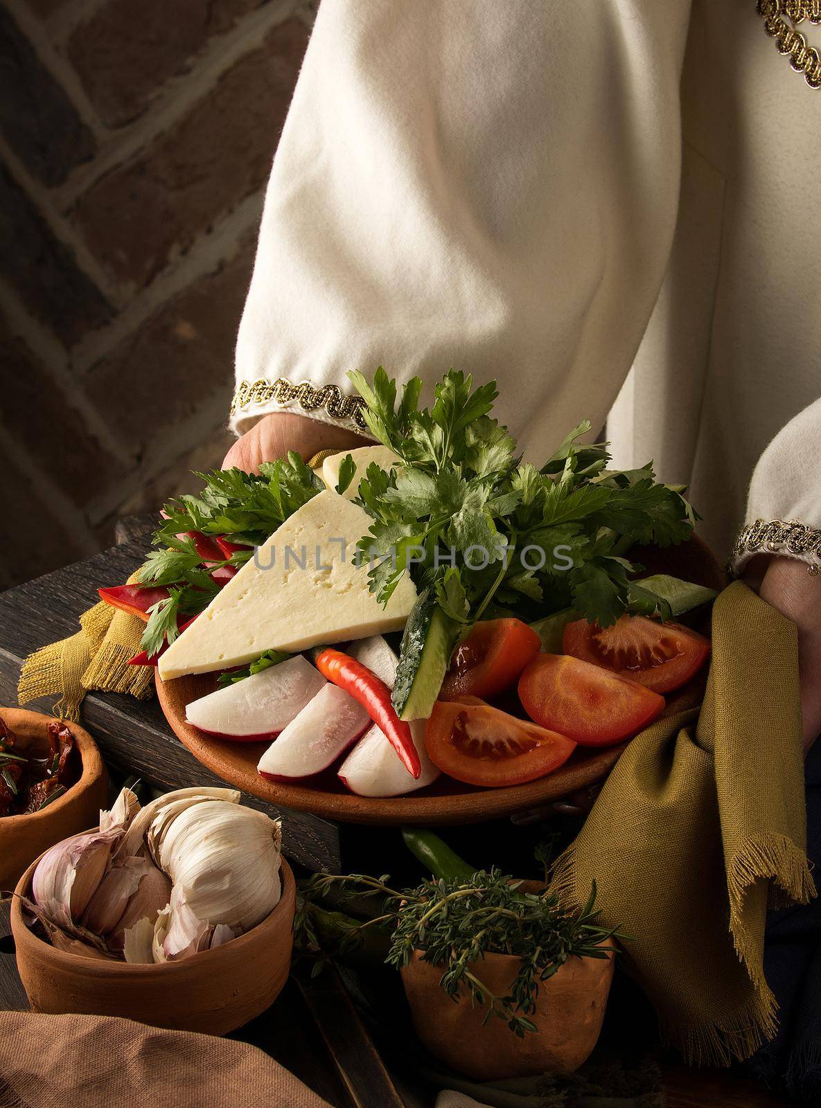 Vertical shot of a waitress presenting a appetizer dish by A_Karim