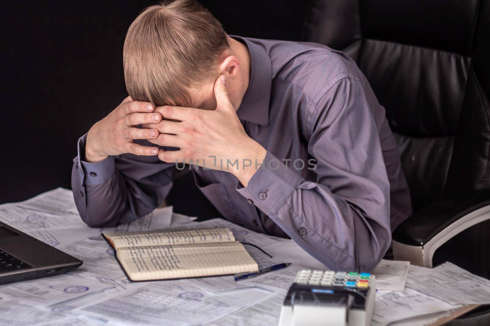 A man with receipts and invoices.Crisis, slump.Insolvent debt obligations on loans among the population have increased.there is an increase in prices for food and medicine.Tariff increases