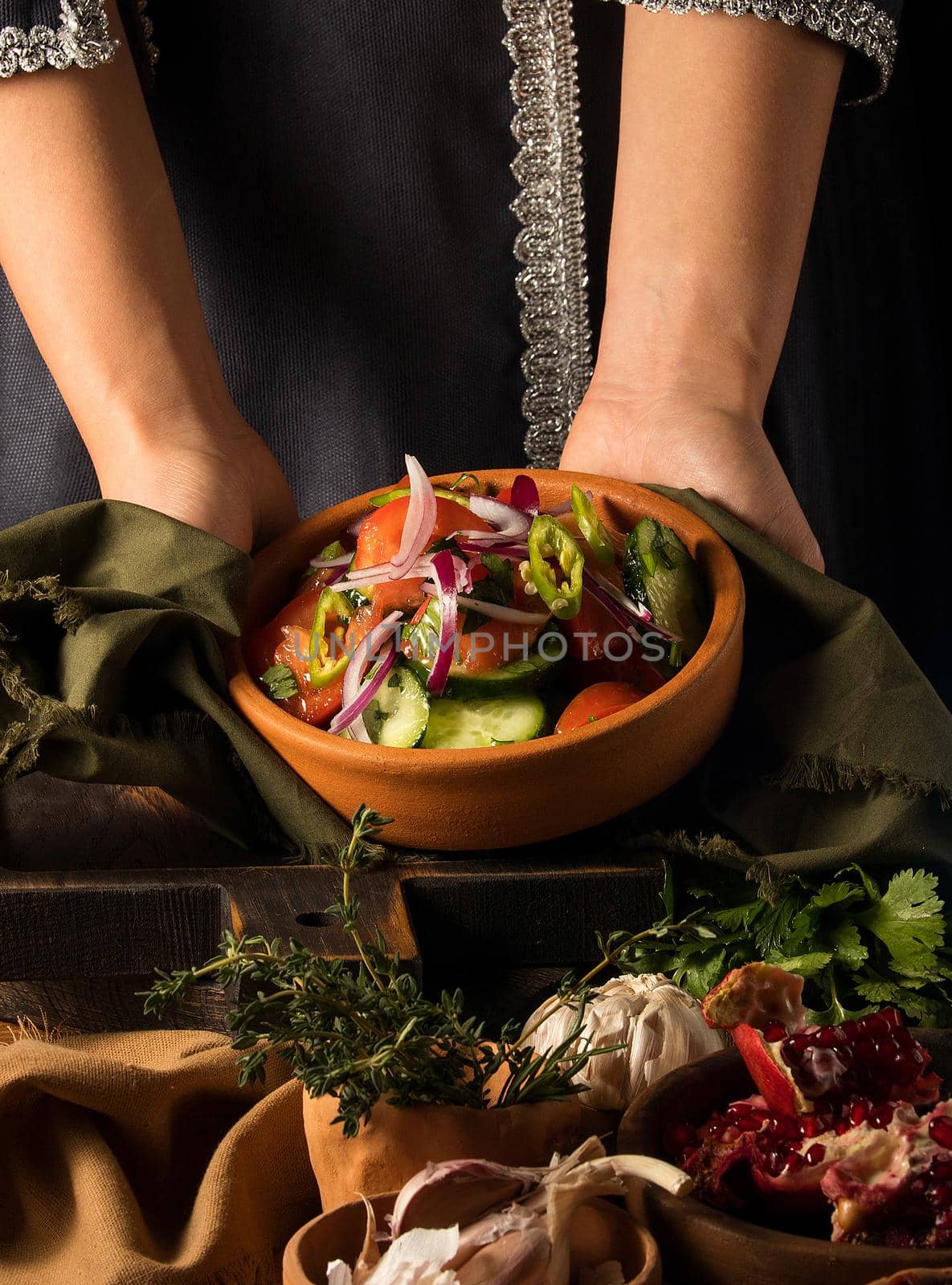 A shot of a person putting dishes on the table