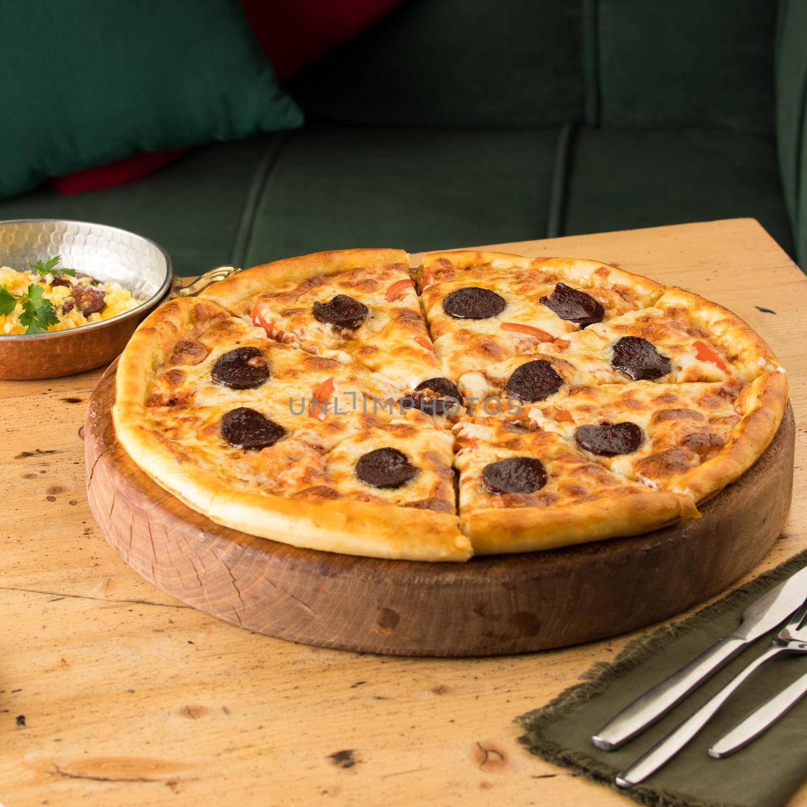 A closeup of freshly-baked pizza on a table