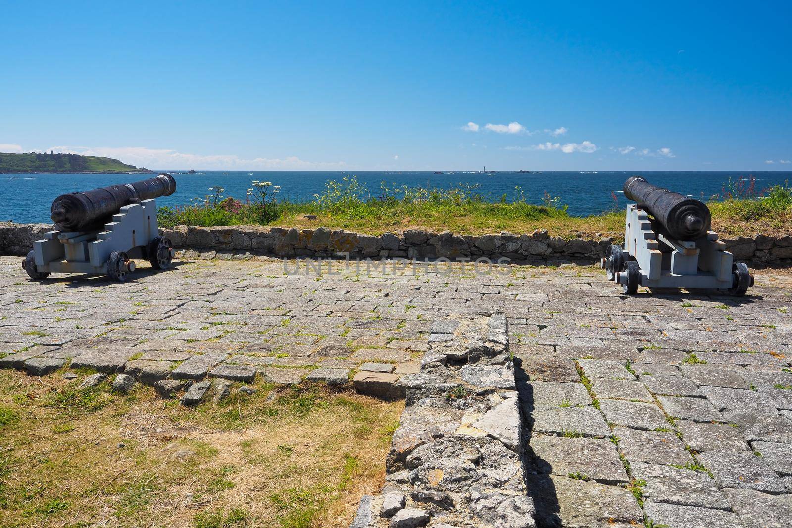 Cannons at L'Eree Battery, overlooking Les Hanois Lighthouse, Guernsey, Channel Islands