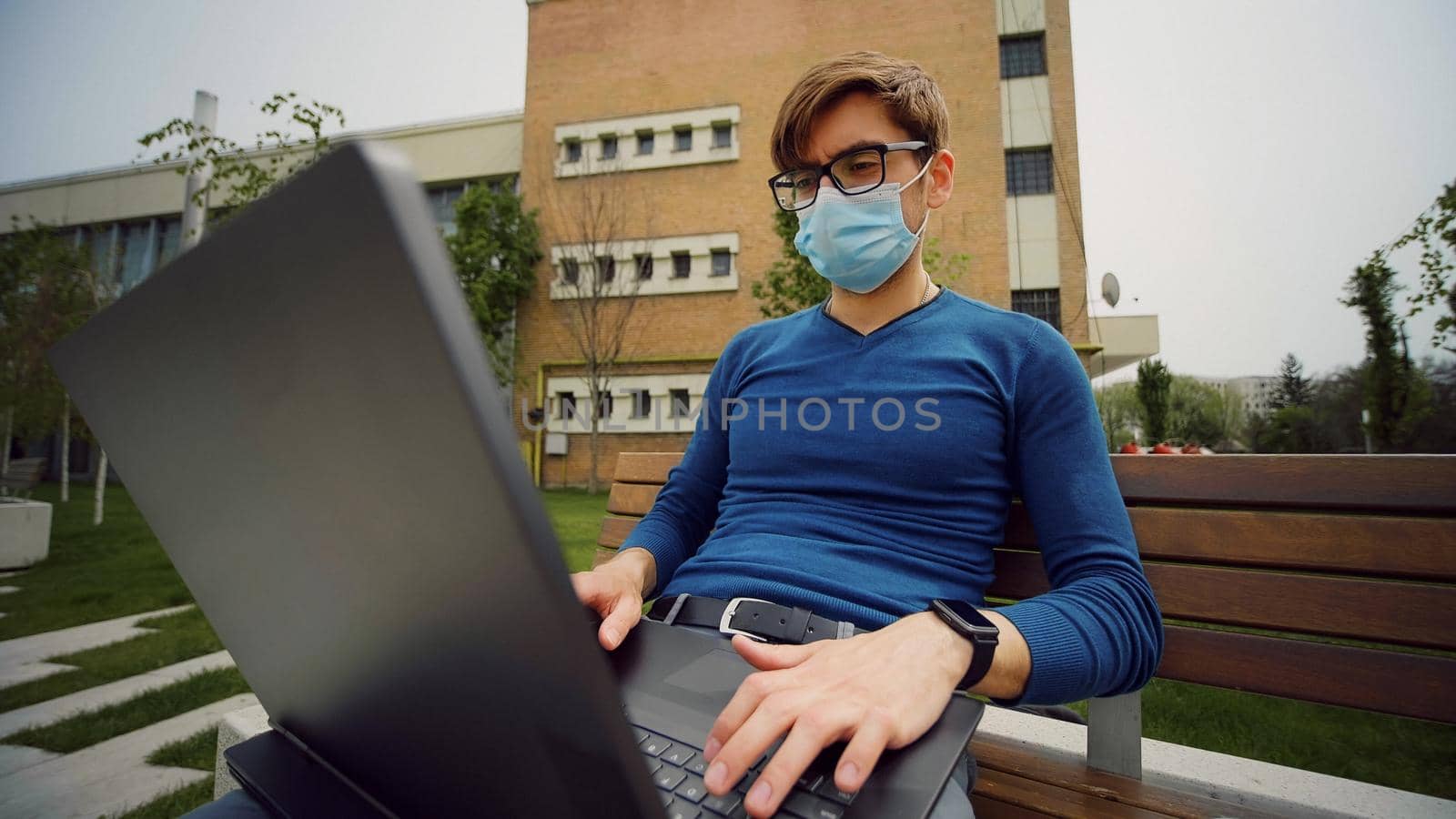 Serious male face , concentrated expression, portrait of pensive caucasian business man working on laptop. by RecCameraStock