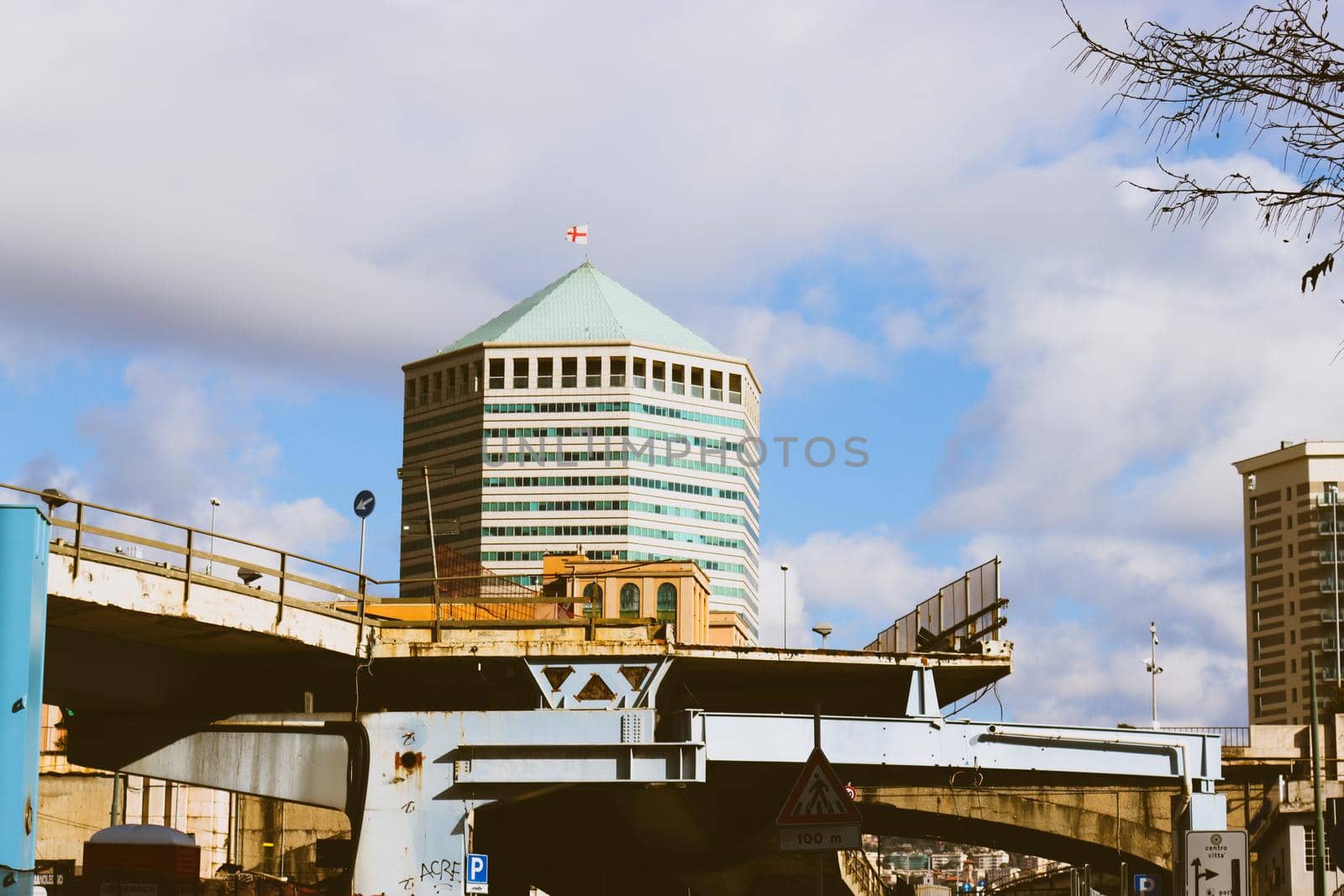 Genova, Italy-January 29, 2022: Beautiful modern high-rise buildings against the sky. 3d illustration on the theme of business success and technology. clouds reflection on the mirror.Industrial zone.