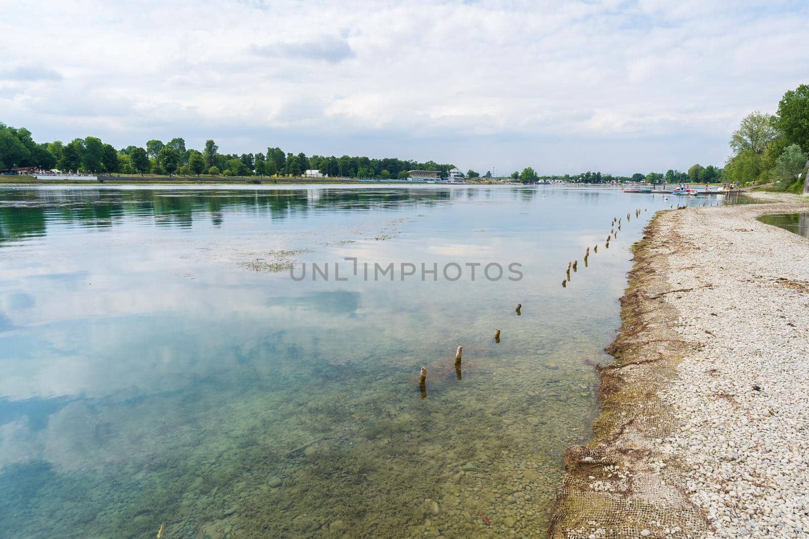 Nice view of Idroscalo lake park, on the left the stands, on the right a quay where young boys and girls prepare their canoes to training.