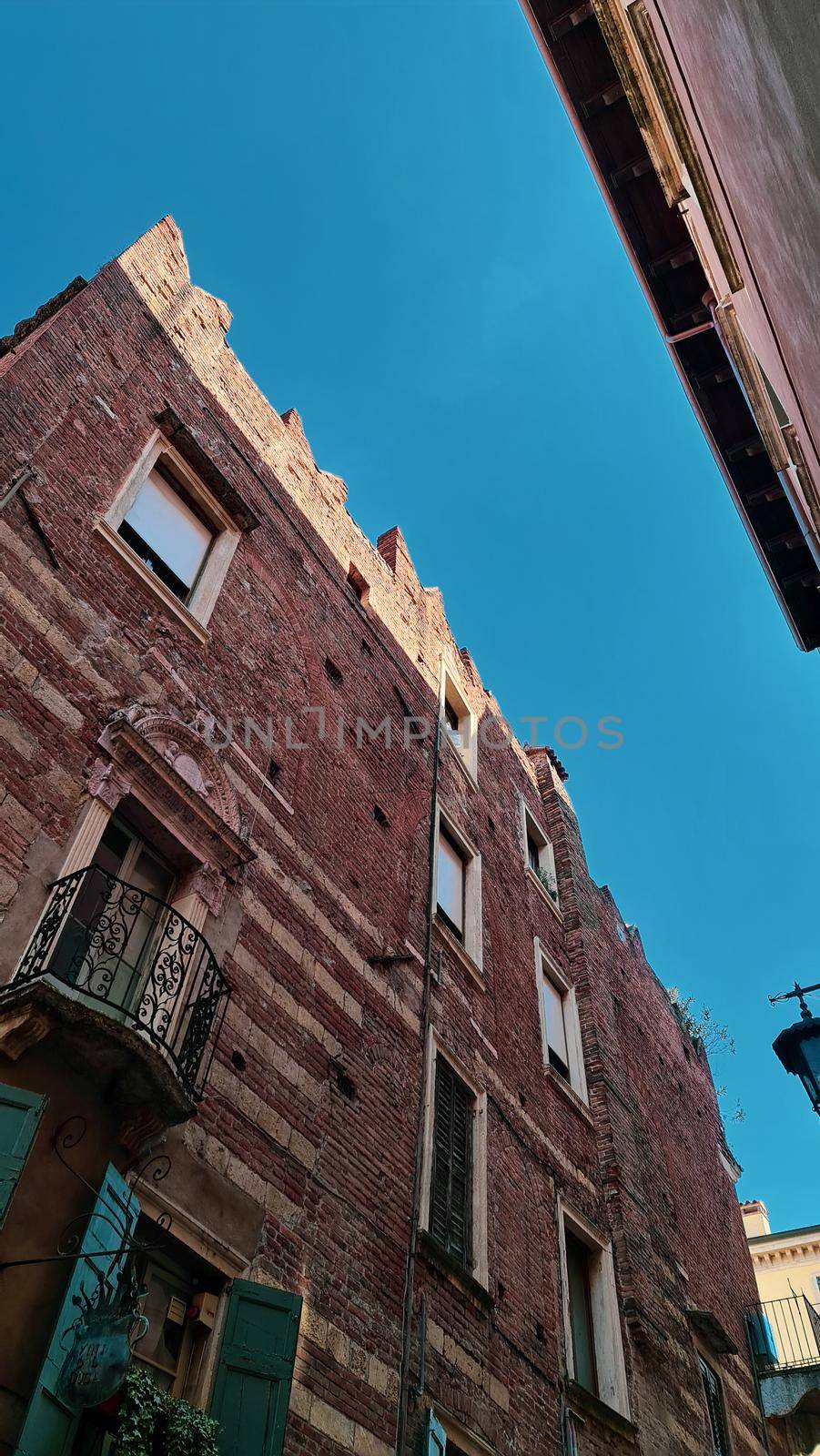 Verona, Italy - March 19, 2022: Beautiful photography of the Arena at Piazza Brà in Verona, a famous Roman amphitheater. Macro view of the old construction by day.