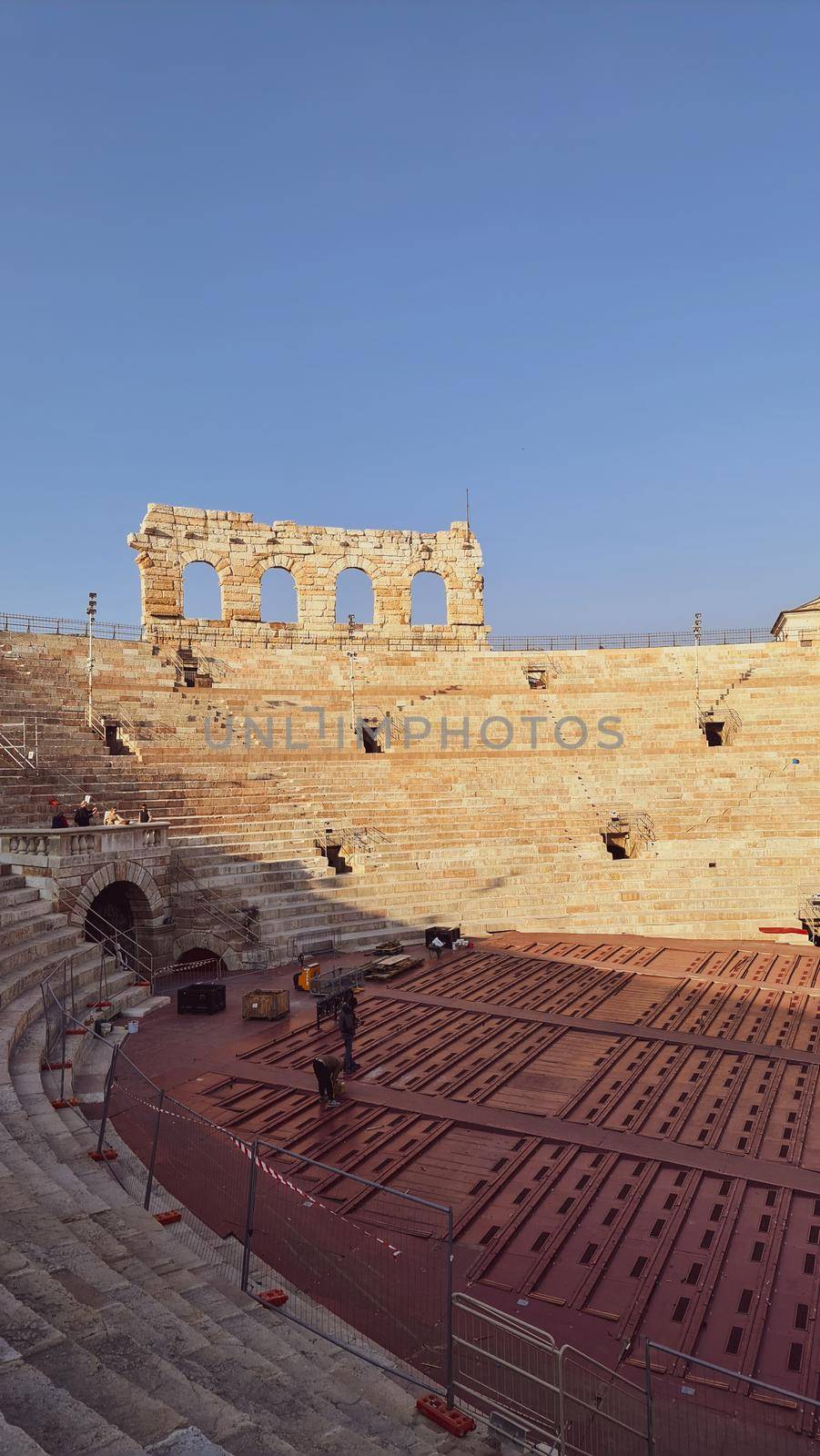 Verona, Italy - March 19, 2022: Beautiful photography of the Arena at Piazza Brà in Verona, a famous Roman amphitheater. Macro view of the old construction by day.