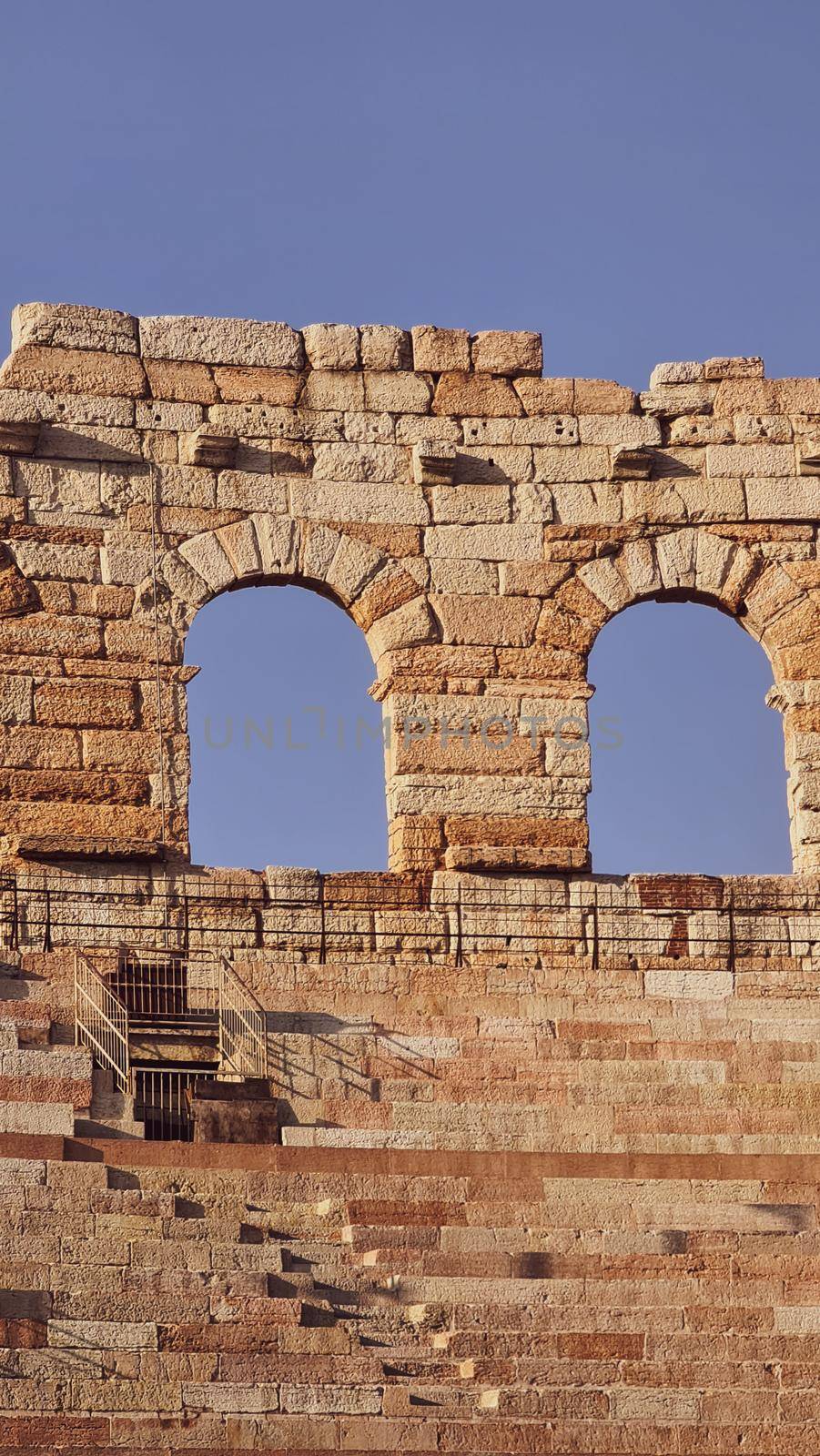 Verona, Italy - March 19, 2022: Beautiful photography of the Arena at Piazza Brà in Verona, a famous Roman amphitheater. Macro view of the old construction by day.