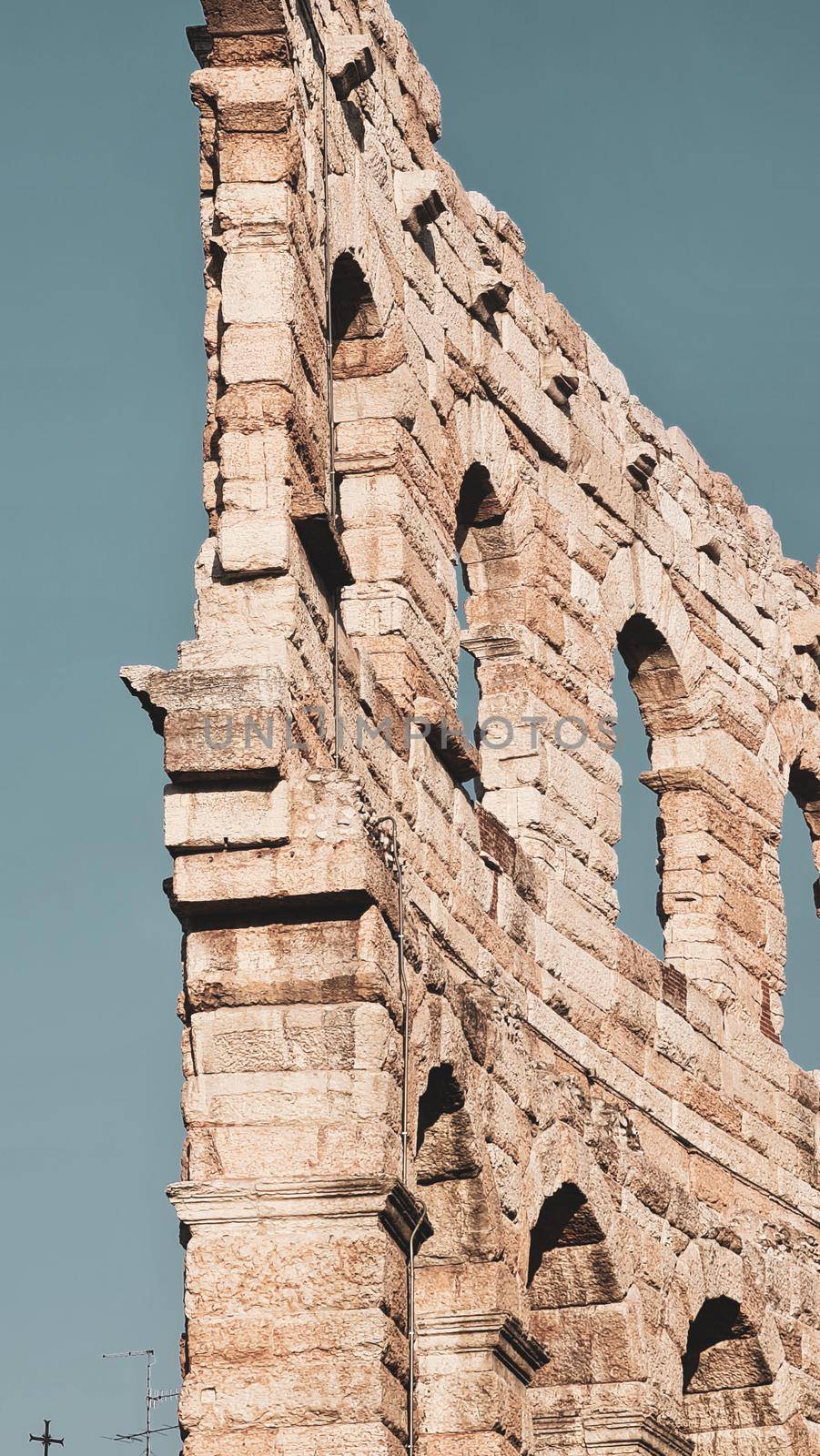 Verona, Italy - March 19, 2022: Beautiful photography of the Arena at Piazza Brà in Verona, a famous Roman amphitheater. Macro view of the old construction by day.