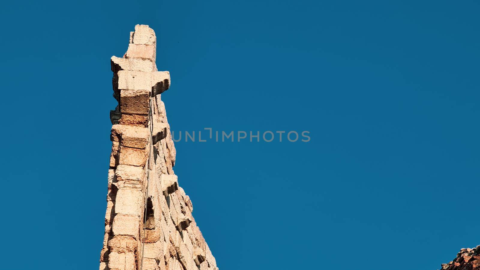 Verona, Italy - March 19, 2022: Beautiful photography of the Arena at Piazza Brà in Verona, a famous Roman amphitheater. Macro view of the old construction by day.