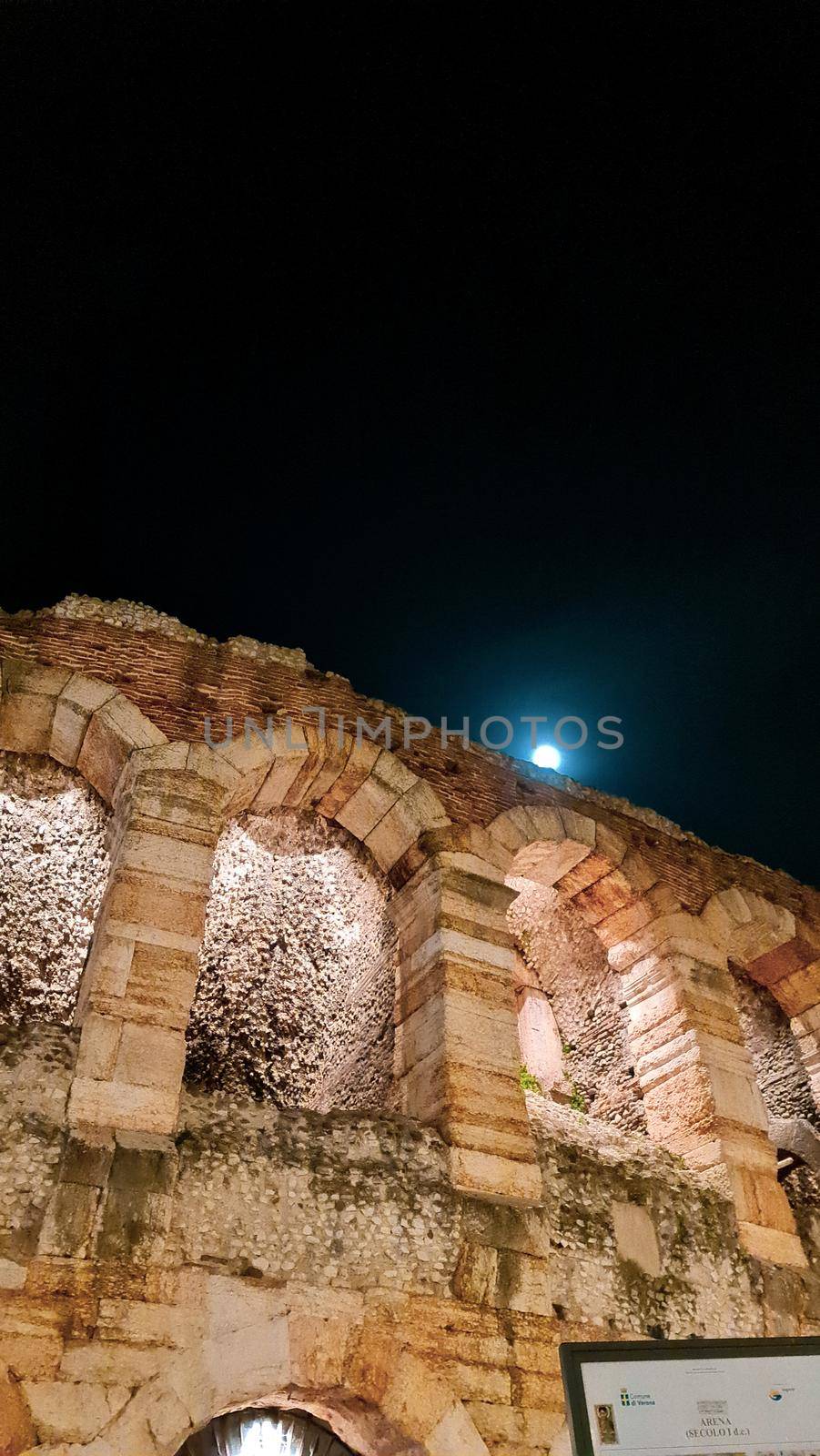 Verona, Italy-March 19, 2022: Beautifull old buildings of Verona. Typical architecture of the medieval period. Aerial view to the city with blue sky in the background. Detailed photography of the old architecture.