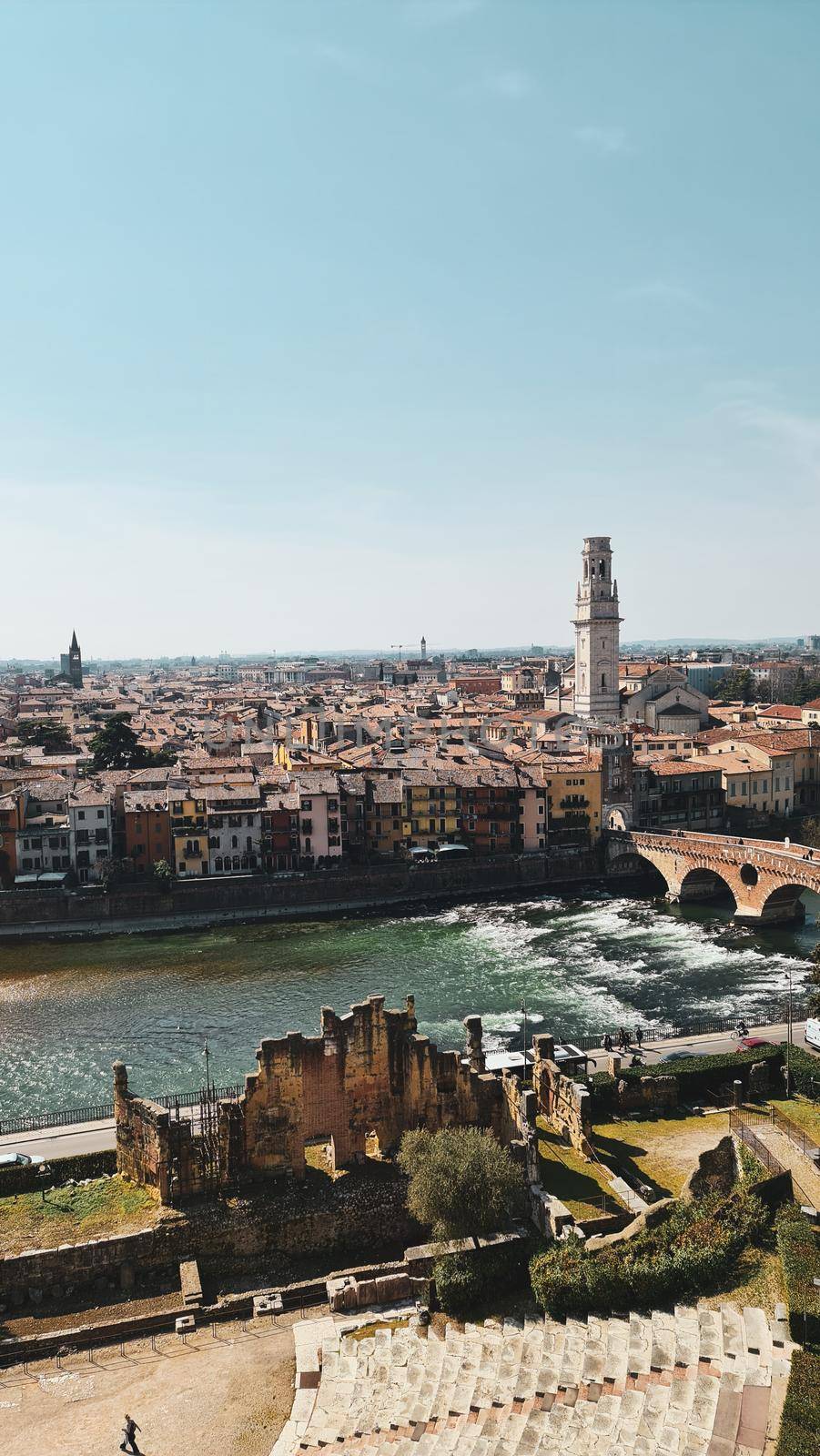 Verona, Italy-March 19, 2022: Beautifull old buildings of Verona. Typical architecture of the medieval period. Aerial view to the city with blue sky in the background. Detailed photography of the old architecture.