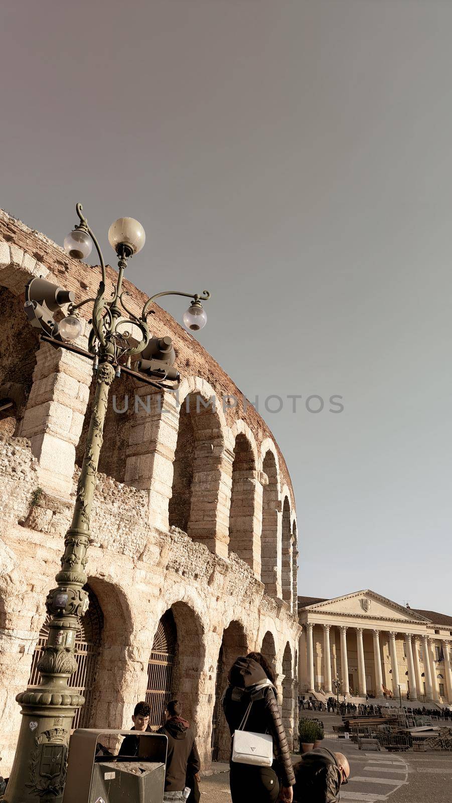 Verona, Italy-March 19, 2022: Beautifull old buildings of Verona. Typical architecture of the medieval period. Aerial view to the city with blue sky in the background. Detailed photography of the old architecture.