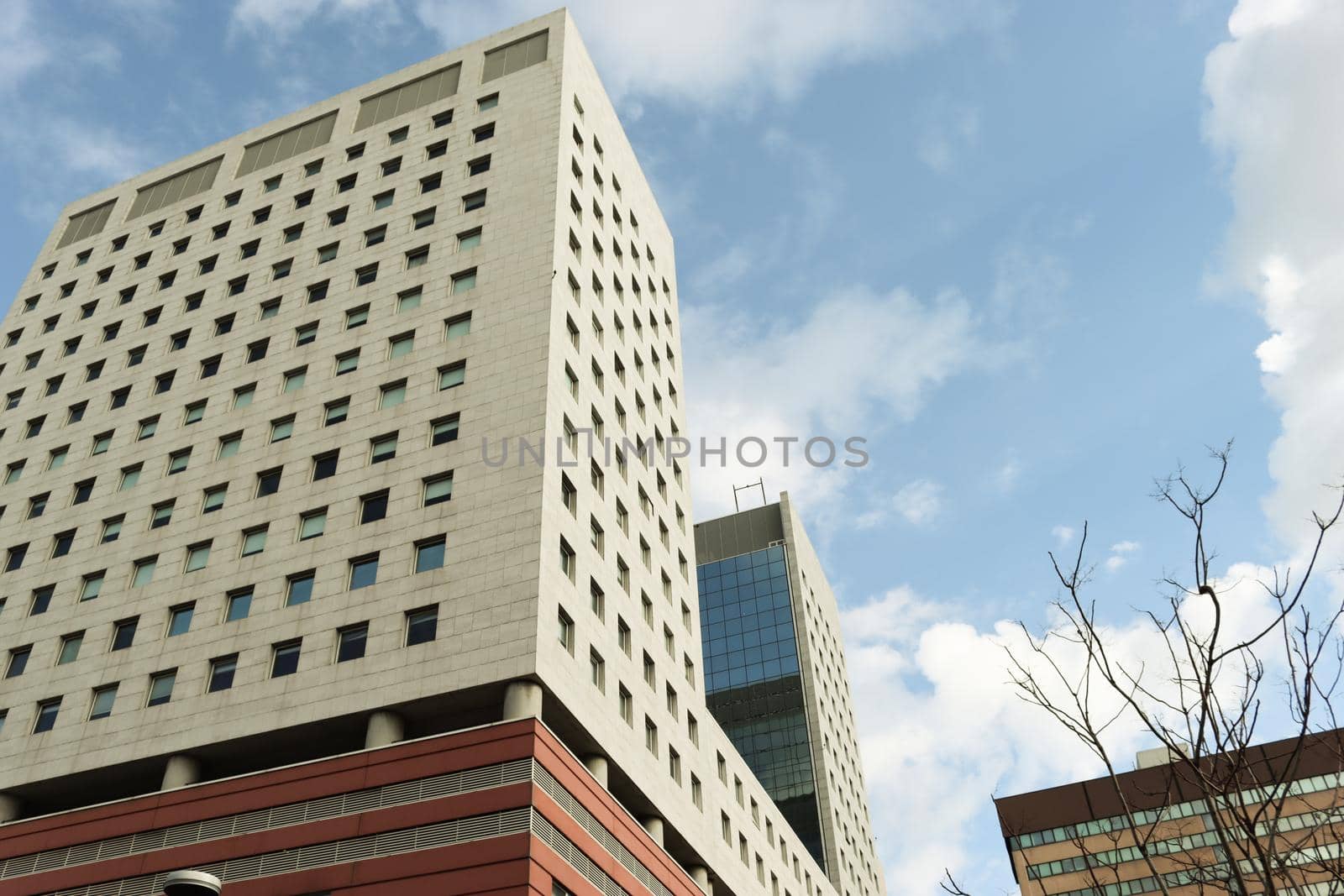 Genova, Italy-January 29, 2022: Beautiful modern high-rise buildings against the sky. 3d illustration on the theme of business success and technology. clouds reflection on the mirror.Industrial zone.