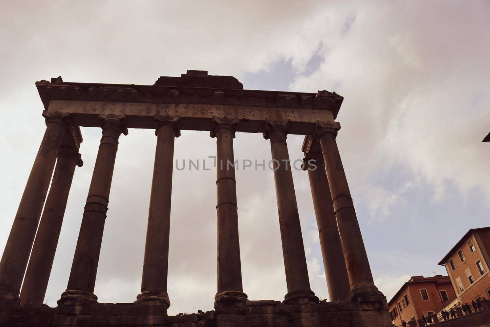 ROME, ITALY - February 05, 2022: Panoramic view of inside part of Colosseum in city of Rome, Italy. Cold and gray sky in the background. Macro photography of the arches.