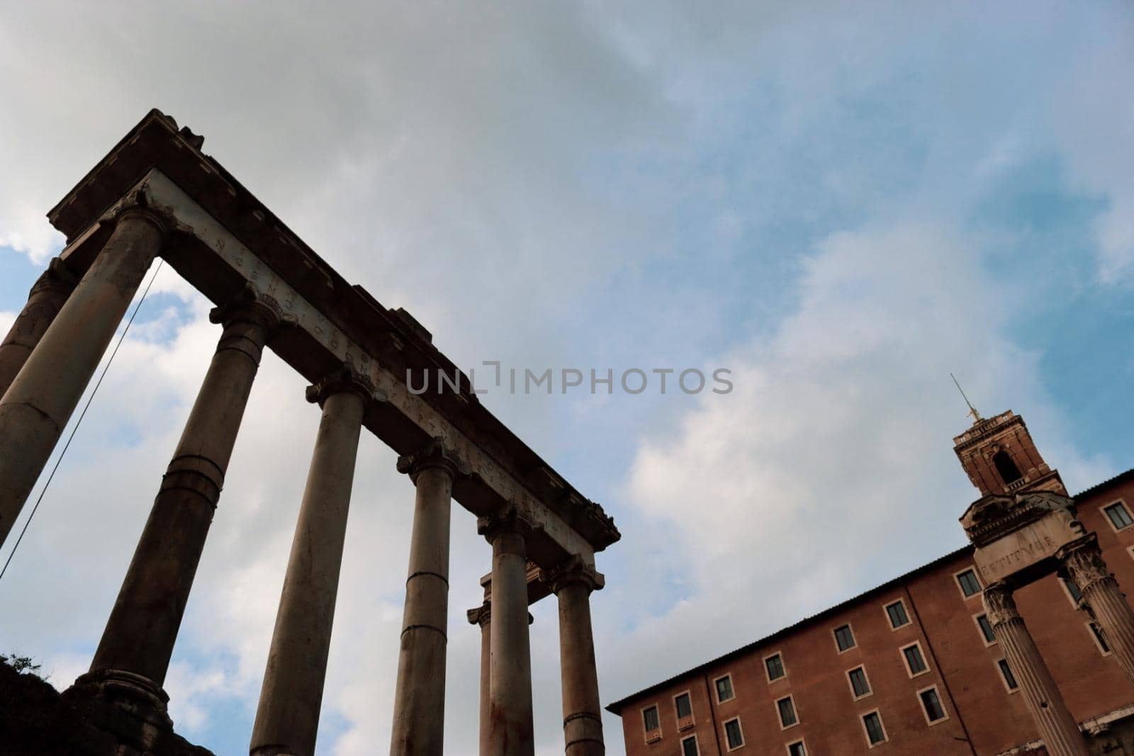 ROME, ITALY - February 05, 2022: Panoramic view of inside part of Colosseum in city of Rome, Italy. Cold and gray sky in the background. Macro photography of the arches.