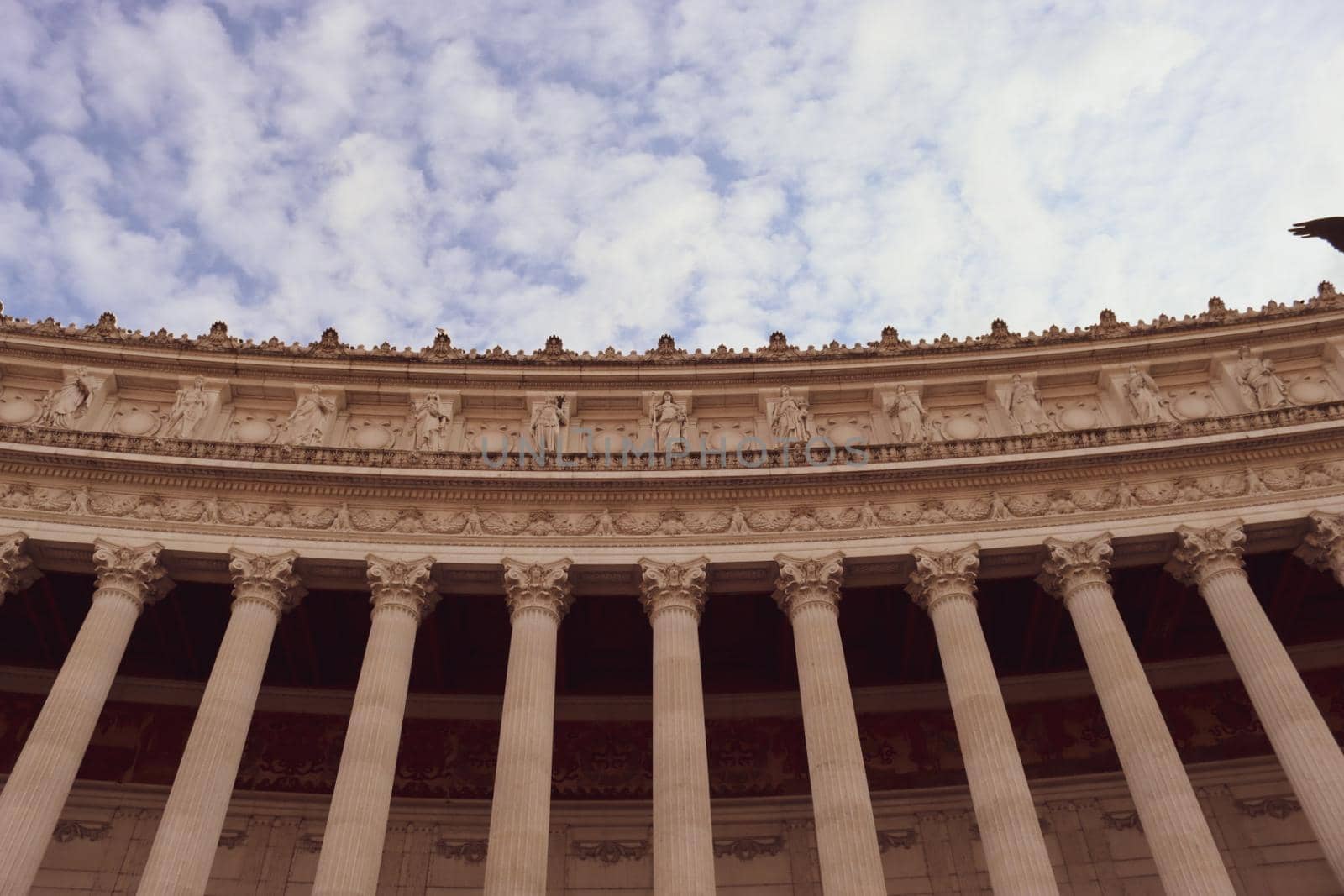 ROME, ITALY - February 05, 2022: Panoramic view of inside part of Colosseum in city of Rome, Italy. Cold and gray sky in the background. Macro photography of the arches.