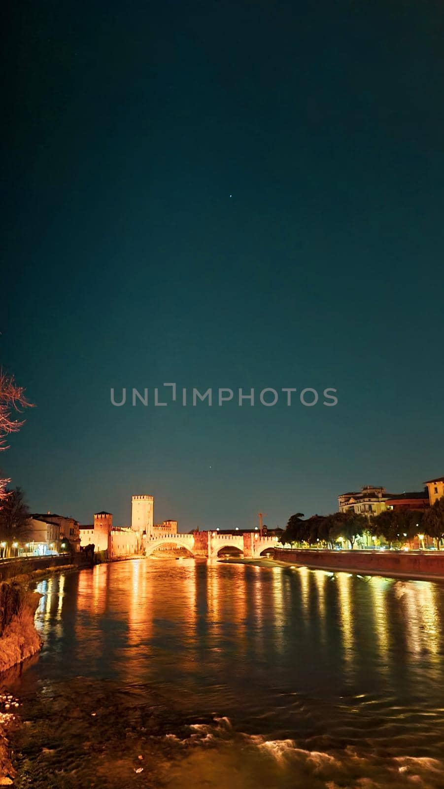 Genova, Italy - May 07, 2022: Panoramic view from the sea to the old town, and the port with beautiful sunset. Genoa bay, harbor, yacht at the pier.tourist destinations.